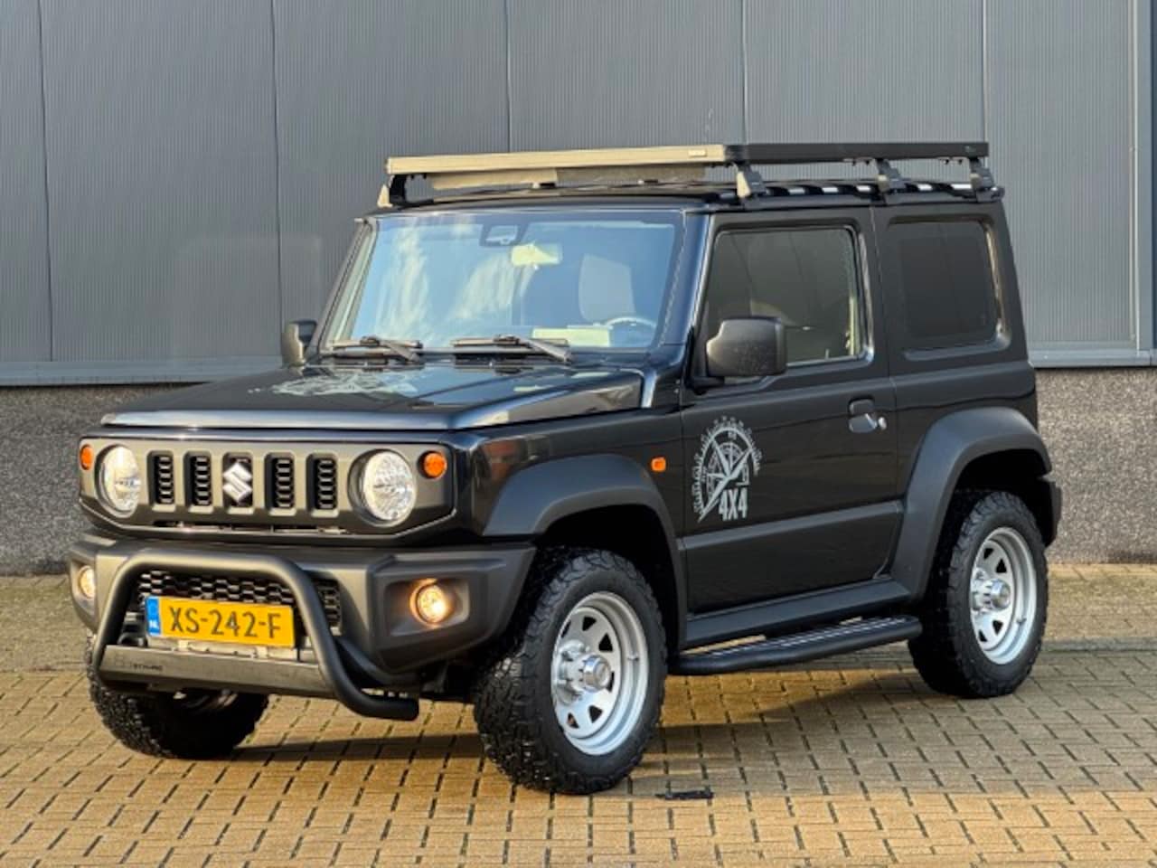 Suzuki Jimny - 1.5 Select All Grip 4x4 - AutoWereld.nl