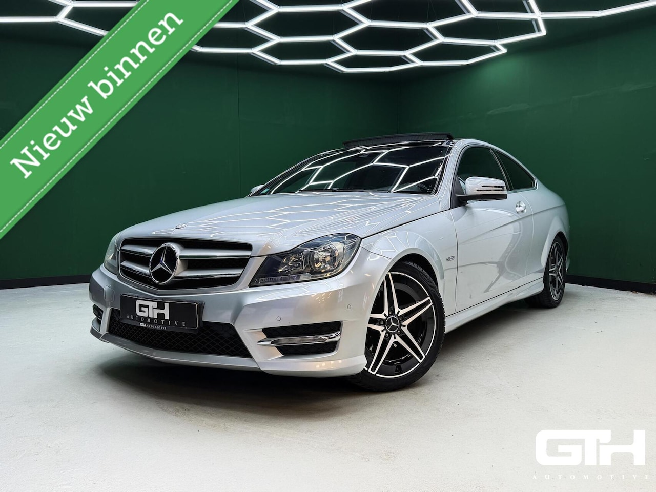 Mercedes-Benz C-klasse Coupé - 180 AMG Cruise | Navi | Pano | NAP - AutoWereld.nl