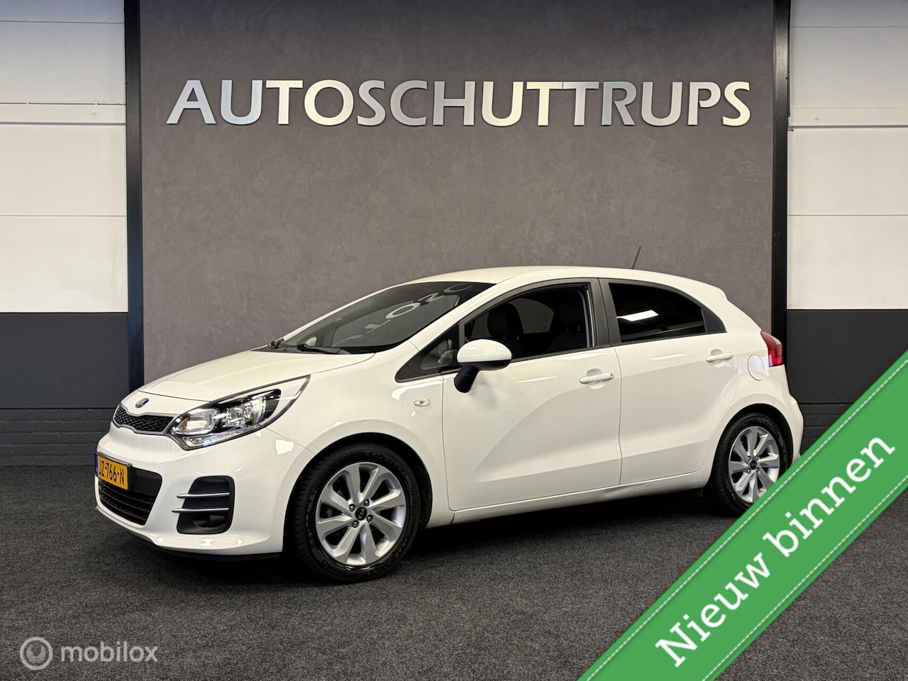 Kia Rio - 1.2 CVVT DynamicLine NAVIGATIE / CRUISE / AFN.TR.HK / AIRCO / CDV / - AutoWereld.nl