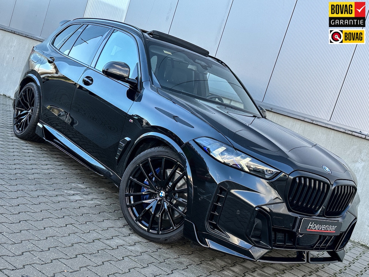 BMW X5 - XDrive50e 490Pk M-sport Black Carbon Hk Pano 22Inch - AutoWereld.nl