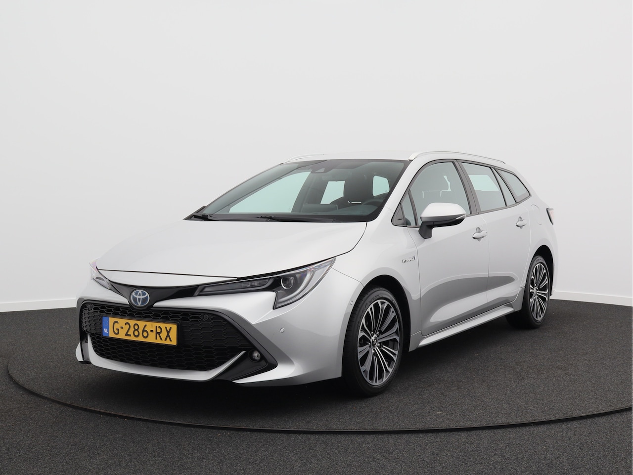 Toyota Corolla Touring Sports - 1.8 Hybrid Business Intro/ lage km/ compleet! - AutoWereld.nl