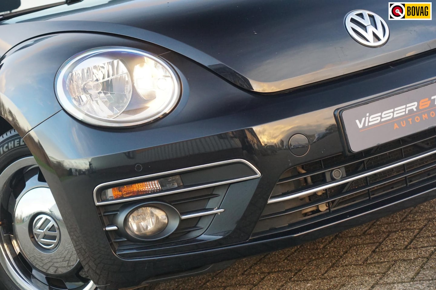 Volkswagen Beetle Cabriolet - 1.2 TSI Design BlueMotion - Deep Black Pearl - Heritage Black Velgen - AutoWereld.nl