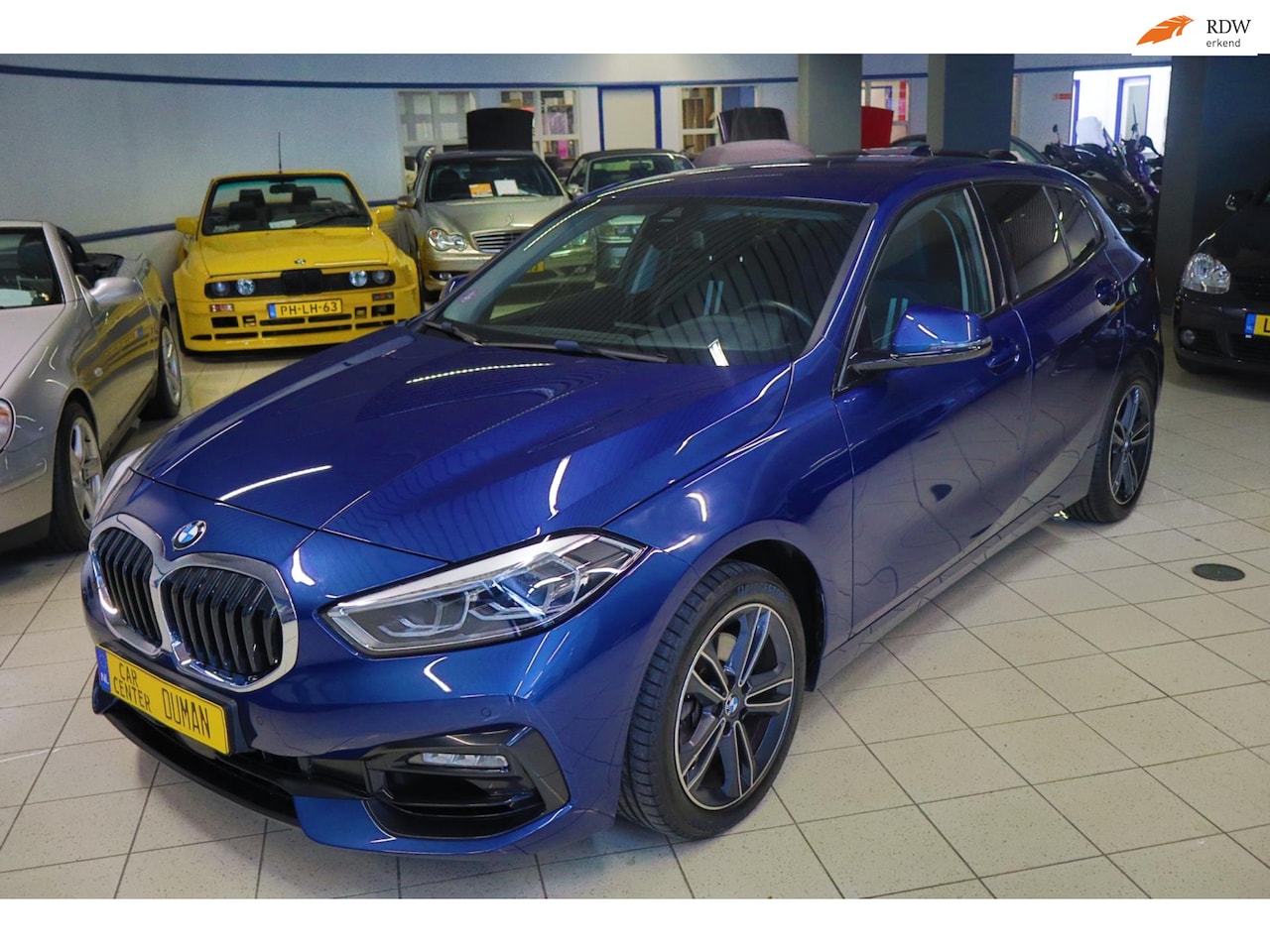 BMW 1-serie - 118i Executive Sport Edition NAP Ambiant Carplay Cruise PDC - AutoWereld.nl