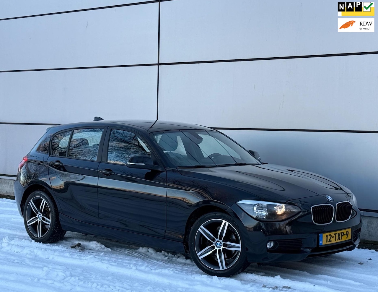 BMW 1-serie - 116i Business+ Automaat |Alpine Audio |Navi |Cruise |Park Sensor |Nap |Boekjes - AutoWereld.nl