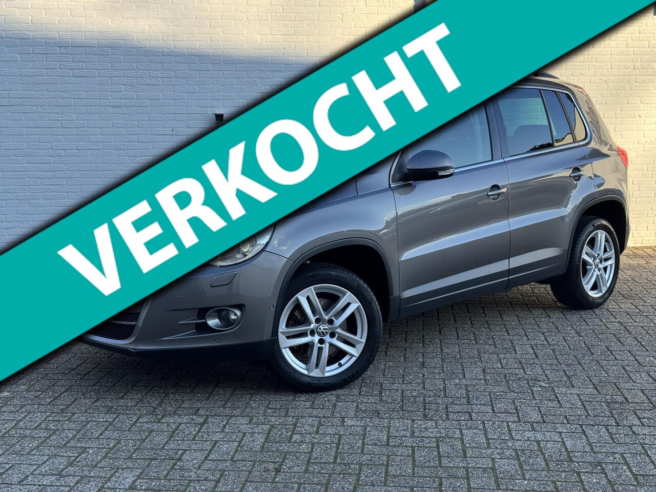 Volkswagen Tiguan - 2.0 TDI Sport&Style 4Motion Climate control Cruise Navi Parkeersensoren v/a Trekhaak 2200 - AutoWereld.nl