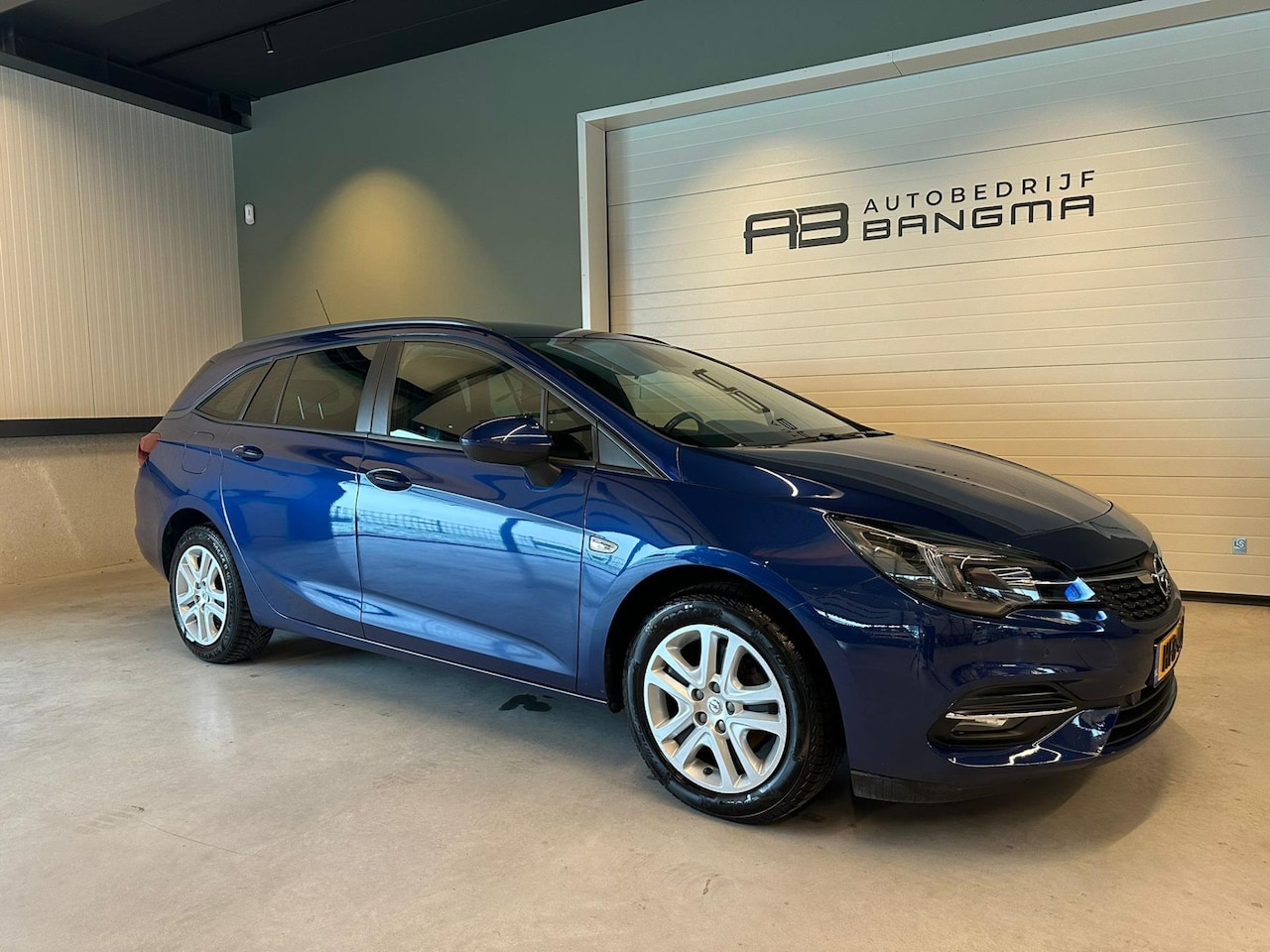 Opel Astra Sports Tourer - 1.2 EDITION-uitv/CLIMA AIRCO/NAVIGATIE/APPLE CARPLAY+ANDROID/BLUETOOTH/ISOFIX/CRUISE CONTR - AutoWereld.nl