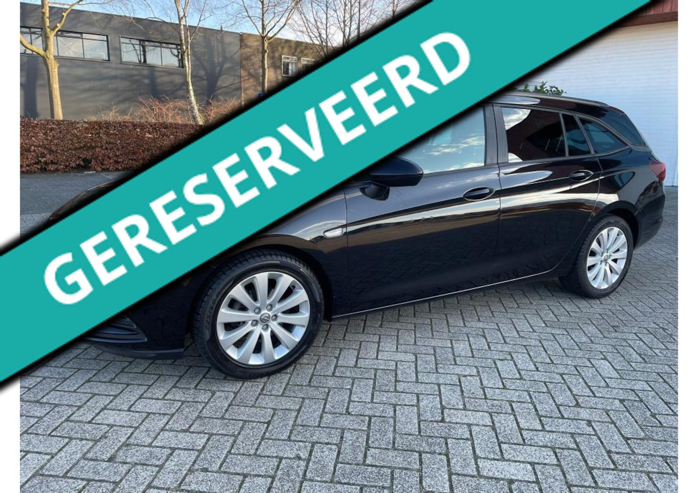Opel Astra Sports Tourer - 1.0 Turbo Business Executive Navigatie (TOPCONDITIE) - AutoWereld.nl