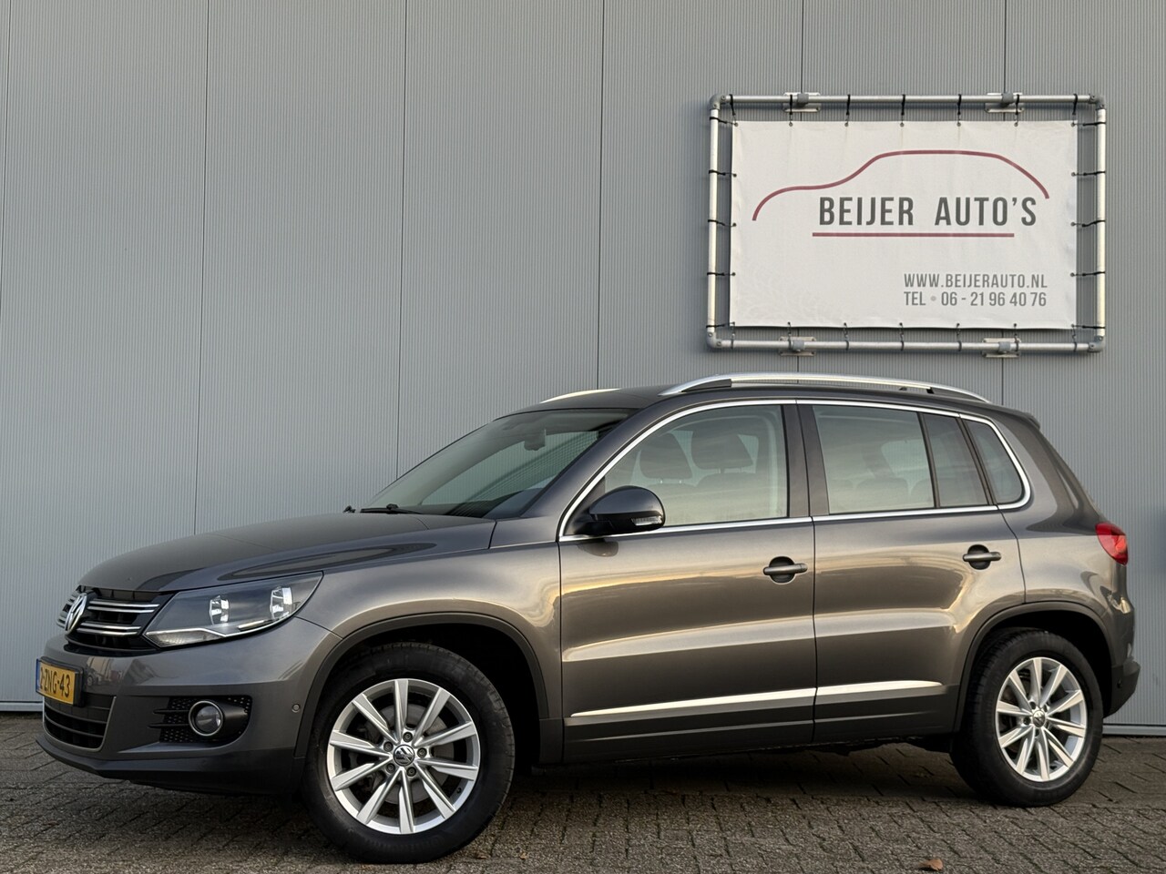 Volkswagen Tiguan - 1.4 TSI Sport&Style Navigatie/Trekhaak/PDC. - AutoWereld.nl