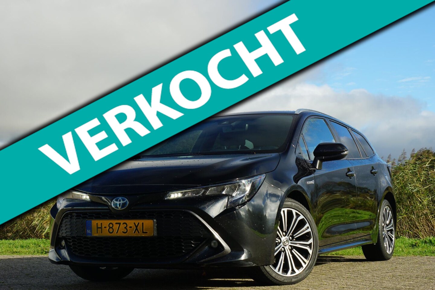 Toyota Corolla Touring Sports - 2.0 Hybrid Business Plus - Night Sky Black - Topstaat - AutoWereld.nl