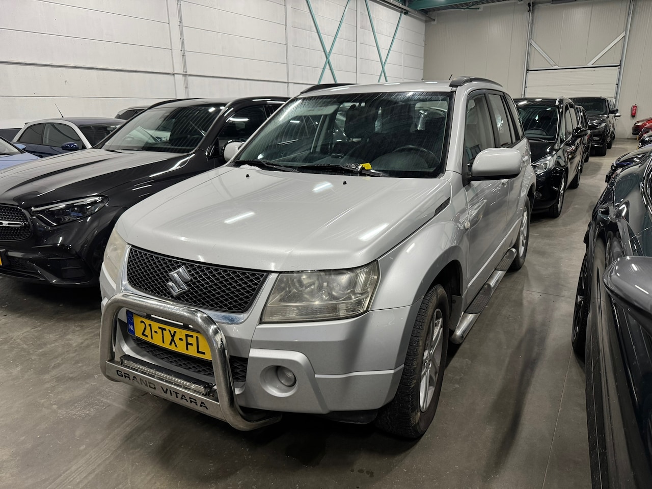 Suzuki Grand Vitara - 2.0-16V Exclusive 4X4 TREKHAAK AIRCO CRUISE ORIG NL NAP - AutoWereld.nl