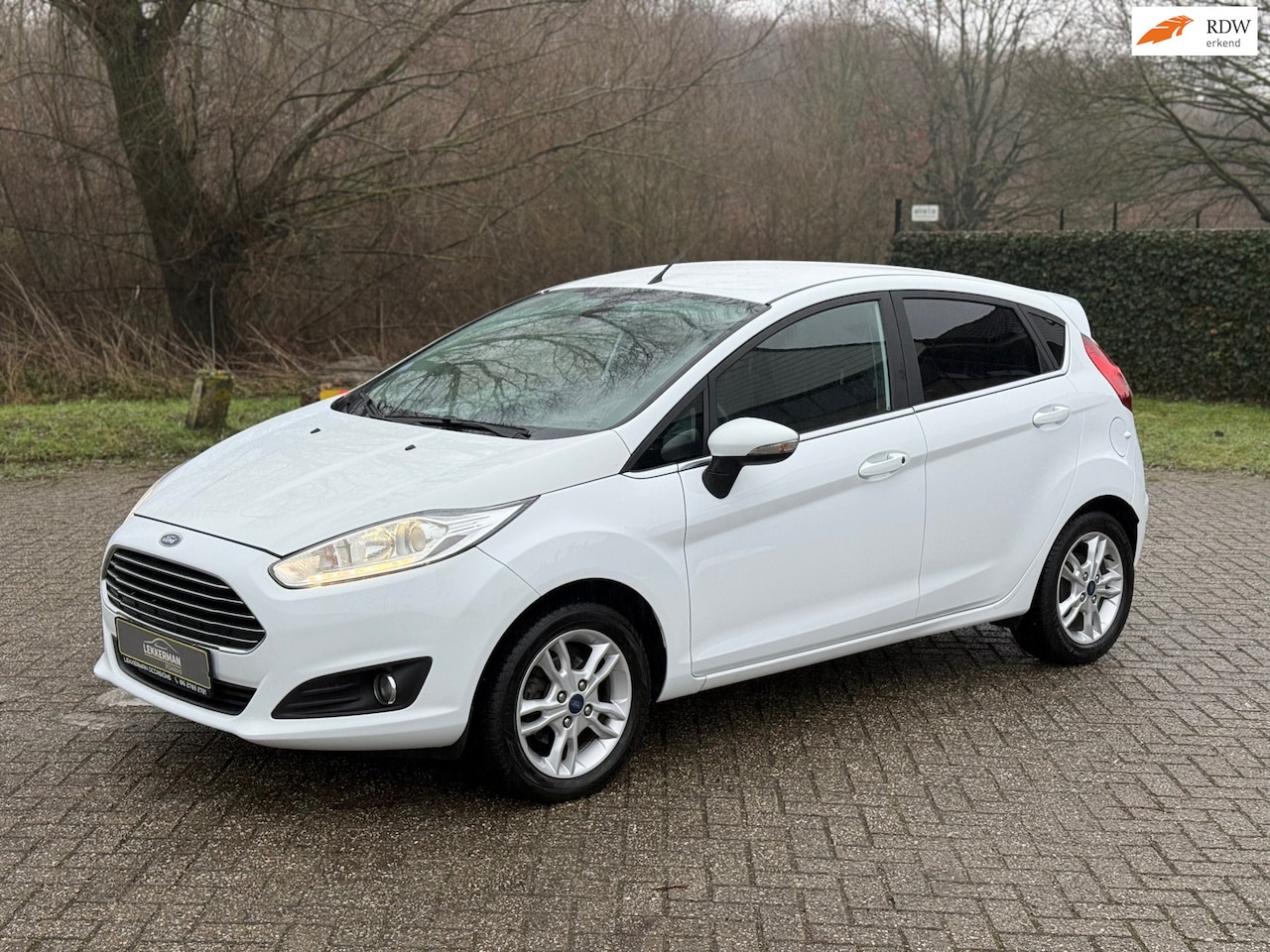 Ford Fiesta - 1.25 Titanium 82PK I 1E EIG I STOELVER I BLUETOOTH I MOOI - AutoWereld.nl