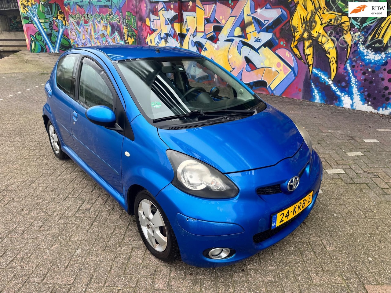 Toyota Aygo - 1.0-12V Dynamic Blue airco pdc stereo elektrische ramen sport velgen stuurbekrachtiging bo - AutoWereld.nl