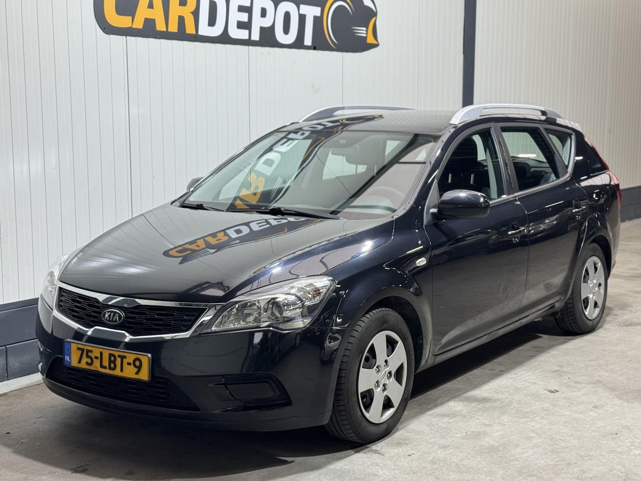 Kia Cee'd Sporty Wagon - 1.4 CVVT X-tra 1.4 CVVT X-tra - AutoWereld.nl