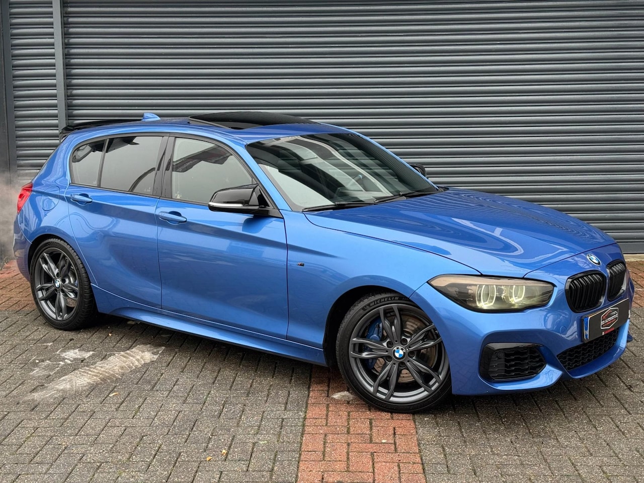BMW 1-serie - M140i High Executive Dak | Rwd | Alcantara | Target Blue eye - AutoWereld.nl