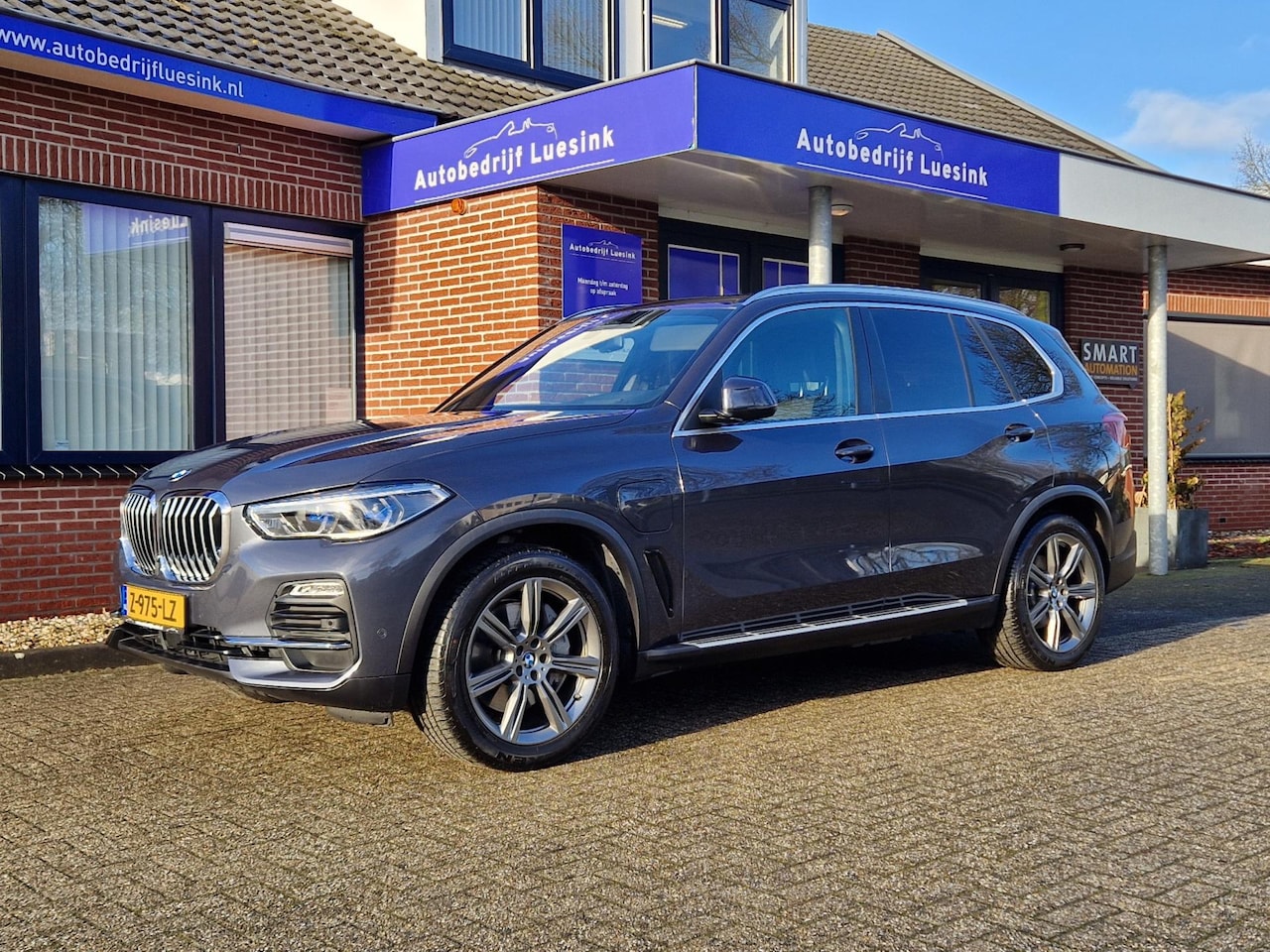 BMW X5 - XDrive45e High Executive H&K Panorama Laser Trekhaak Head Up Comfortstoelen ACC Warmte-com - AutoWereld.nl