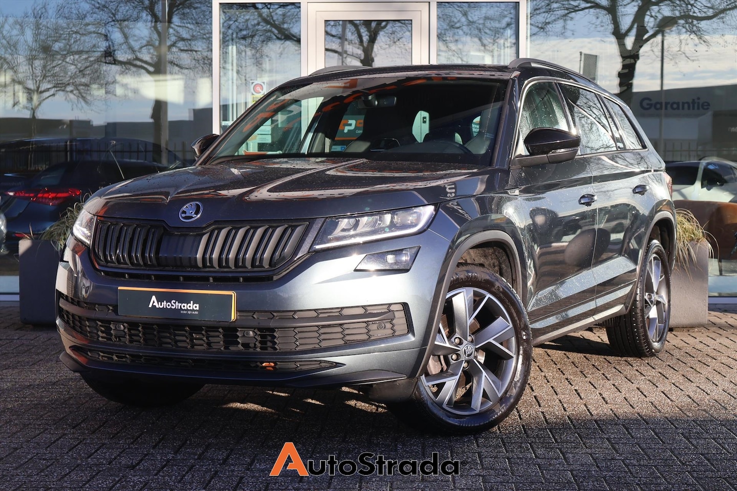 Skoda Kodiaq - 1.5 SportLine TSI ACT 150pk | 7 Persoons | Stoelverwarming | Camera | Virtual | Trekhaak | - AutoWereld.nl