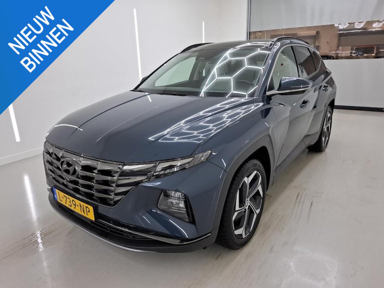 Hyundai Tucson - 1.6 T-GDI HEV PREMIUM SKY I SCHUIF/KANTELDAK I STOELVERWARMING I AUTOMAAT I APPLE CARPLAY - AutoWereld.nl