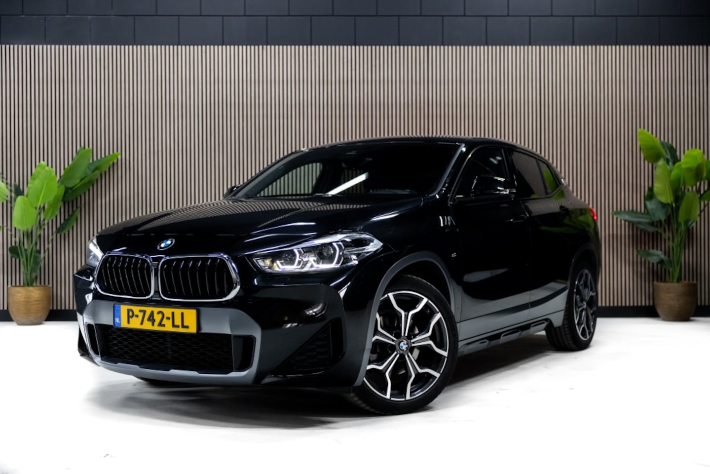 BMW X2 - sDrive18i Hi.Ex.Ed. | M Sport | Stoelverwarming | PDC | Navi | - AutoWereld.nl