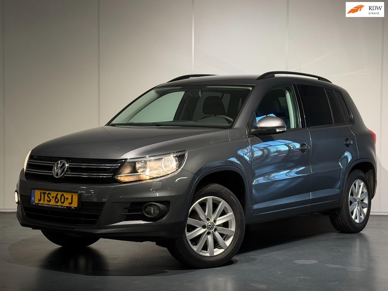 Volkswagen Tiguan - 1.4 TSI Easyline /Clima/Cruise/Elek. Pakket/LMV/Trekhaak - AutoWereld.nl