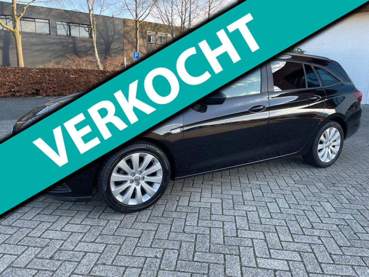 Opel Astra Sports Tourer - 1.0 Turbo Business Executive Navigatie (TOPCONDITIE) - AutoWereld.nl
