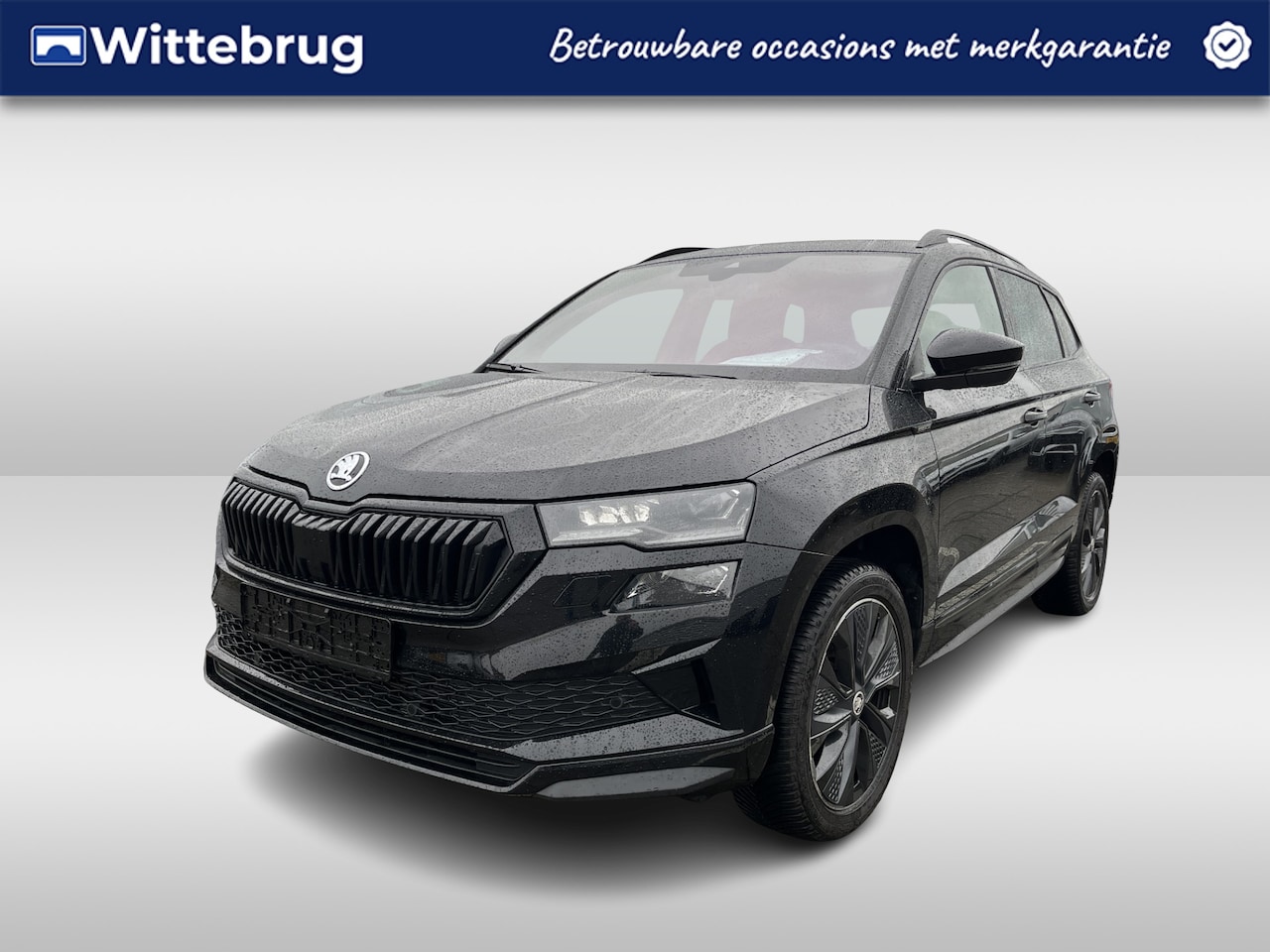 Skoda Karoq - 1.5 TSI ACT 150pk Sportline DSG Automaat Panoramadak / Lederen interieur / Navigatie / Ele - AutoWereld.nl