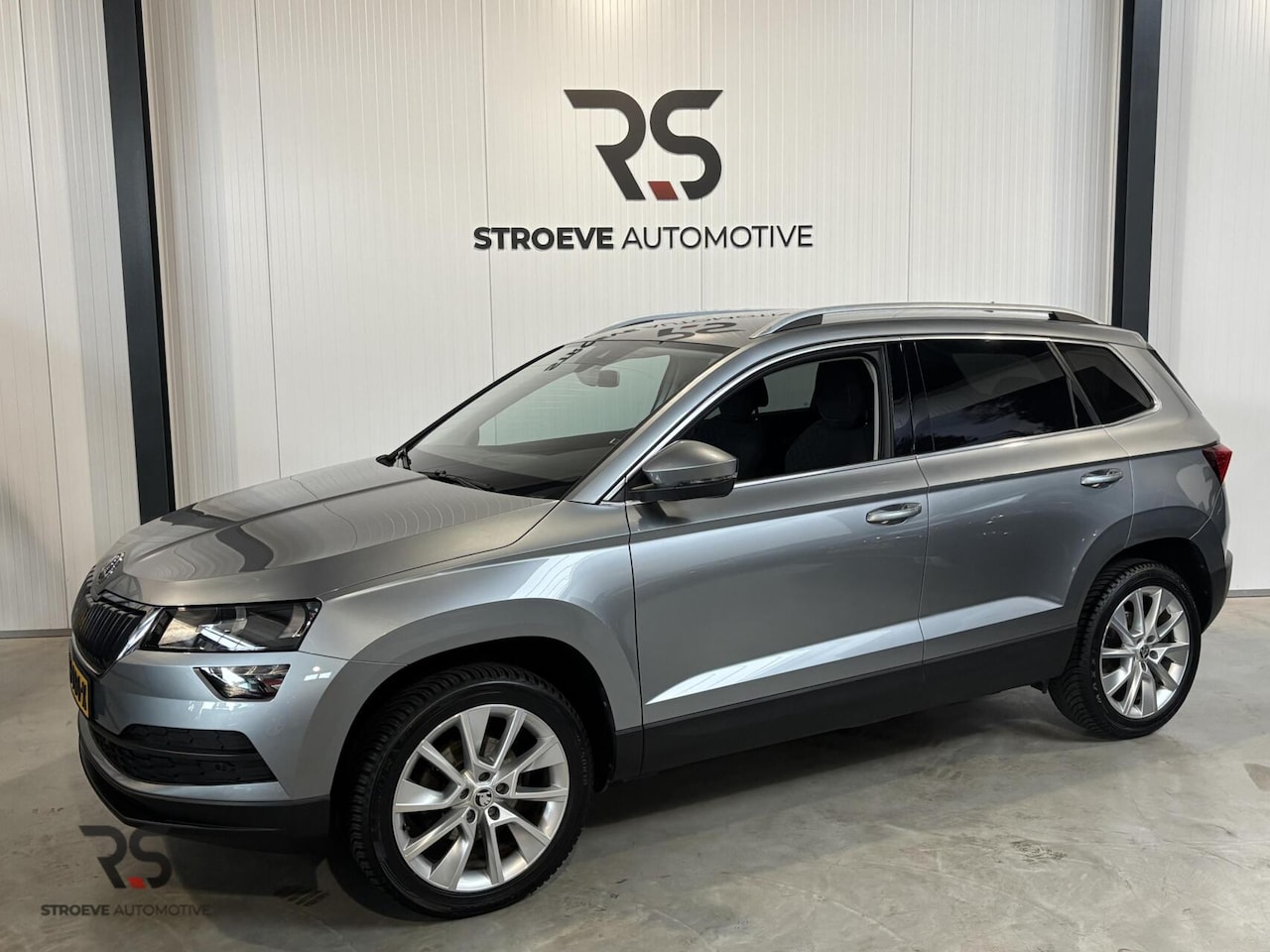 Skoda Karoq - 1.0 TSI 115 pk handg. Ambition Buss. | Navi | Cruise | PDC | CarPlay | Clima | DAB | Org. - AutoWereld.nl