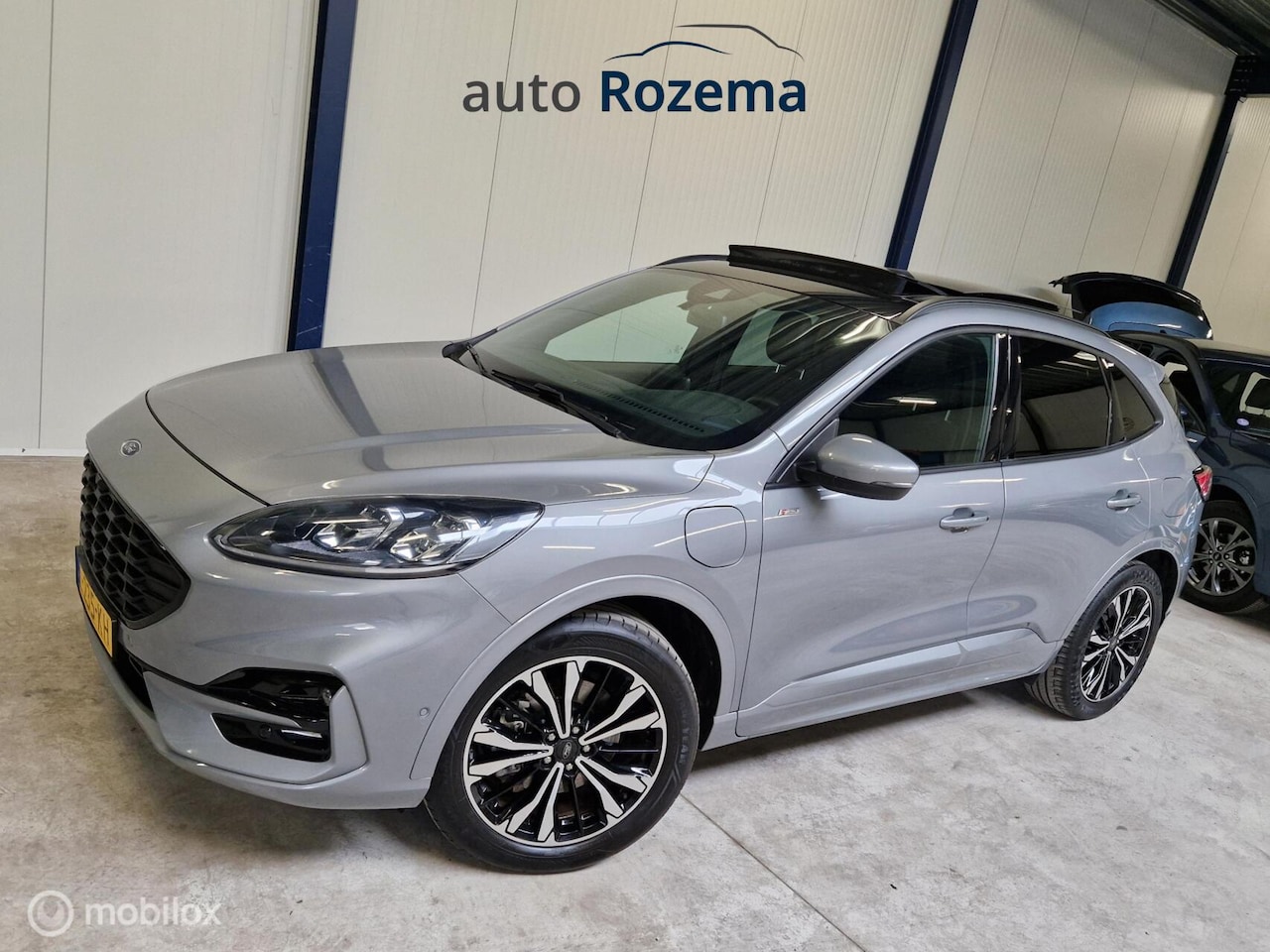Ford Kuga - 2.5 PHEV ST-Line X Ecc Navi Leder-Alcan Elec-Haak 360 Camera Dak - AutoWereld.nl