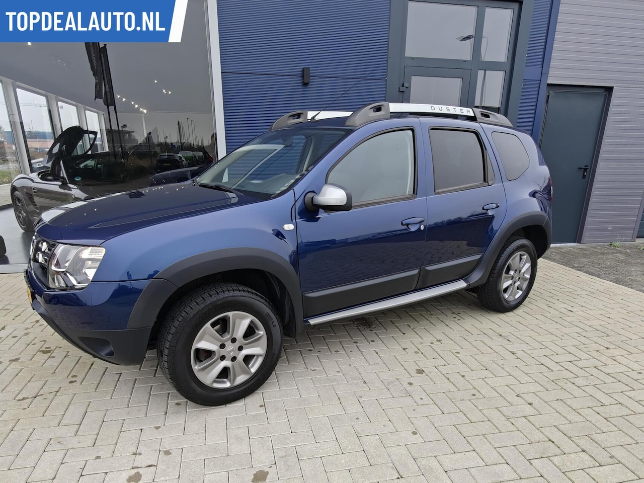 Dacia Duster - 1.2 TCe 4x2 Lage Km/Leder/Cruise/Trekhaak - AutoWereld.nl