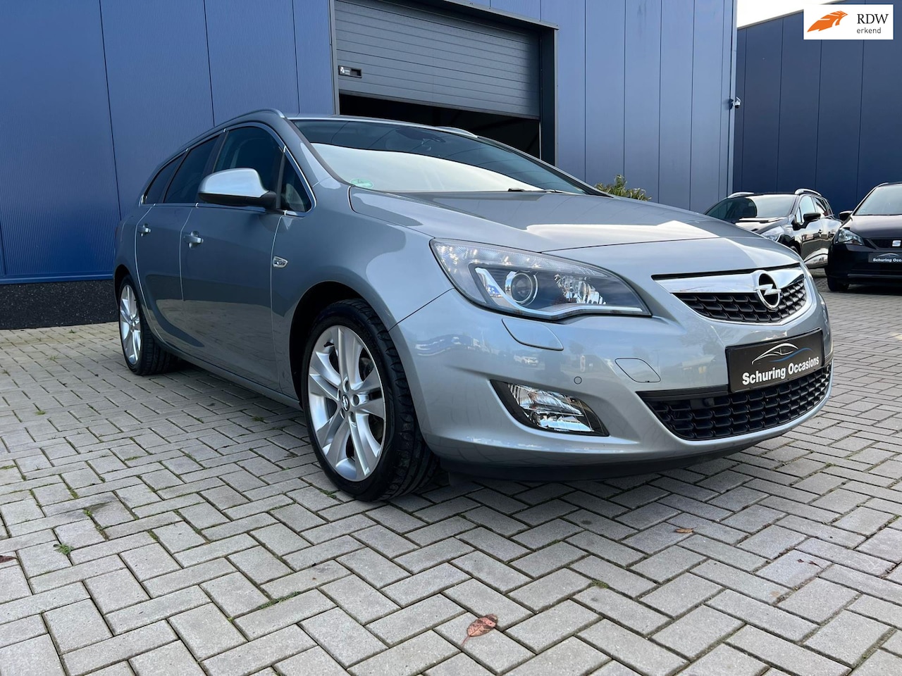 Opel Astra Sports Tourer - 1.4 Turbo Cosmo / PDC / CLIMATE / CRUISE / NAVIGATIE / STOEL-STUUR VERWRMING / TREKHAAK - AutoWereld.nl