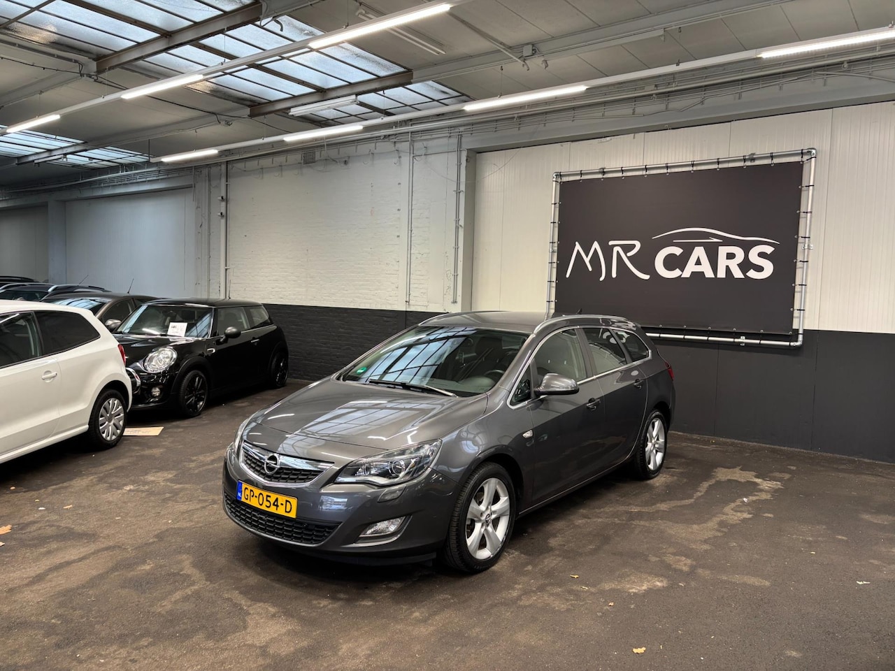 Opel Astra Sports Tourer - 1.4 Turbo Edition Airco/Cruise Control - AutoWereld.nl
