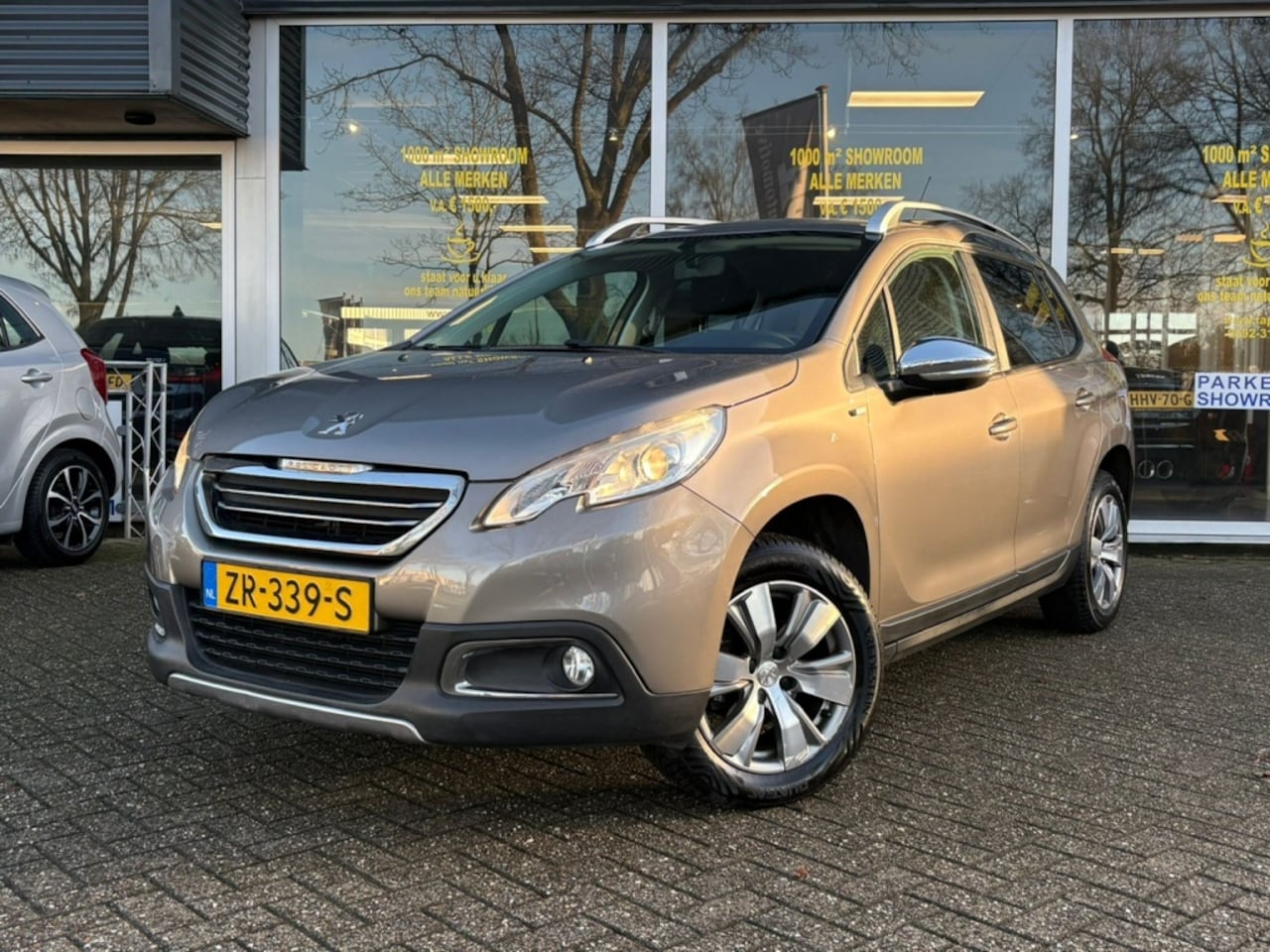 Peugeot 2008 - 1.2 PureTech Allure Cruise/Nav/PDC - AutoWereld.nl