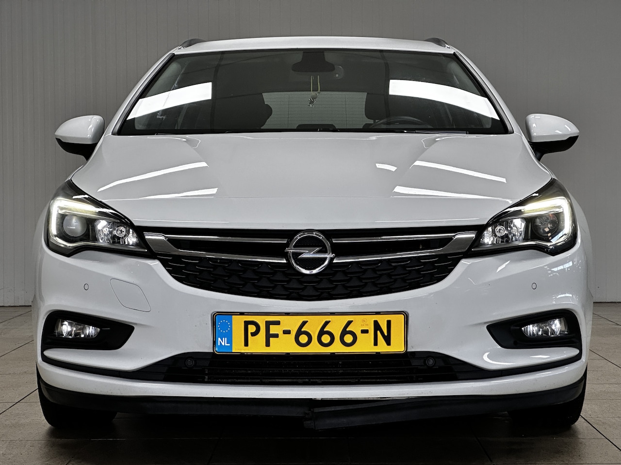 Opel Astra Sports Tourer - 1.0 Online Edition/ PDC V+A/ Apple + Android/ Navi/ DAB+/ Airco/ Cruise/ Elek. pakket/ Iso - AutoWereld.nl