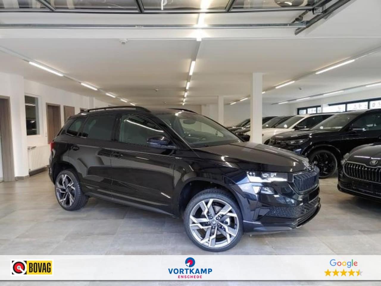 Skoda Karoq - 1.5 TSI DSG SPORTLINE TREKHAAK/CAMERA/CARPLAY/ACC/STOELVERW/E-KLEP - AutoWereld.nl