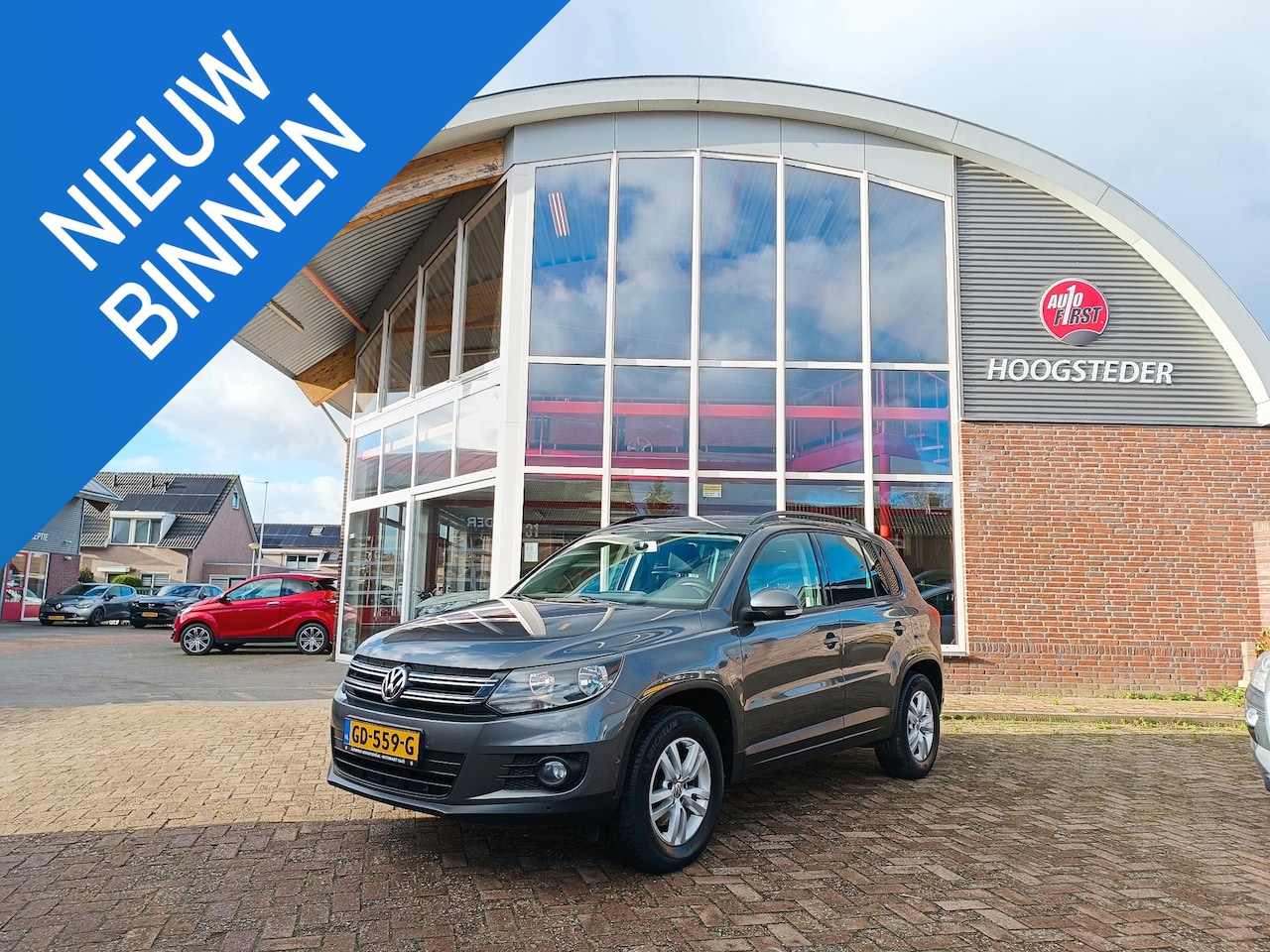 Volkswagen Tiguan - 1.4 TSI Comfort&Design, navigatie, trekhaak, pdc - AutoWereld.nl
