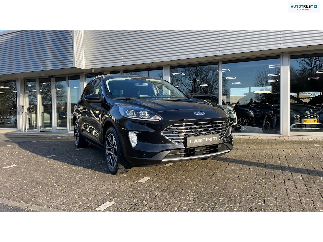 Ford Kuga - 2.5 PHEV Titanium 2.5 PHEV Titanium, Navigatie, Cruise control, Camera, Climate control. - AutoWereld.nl