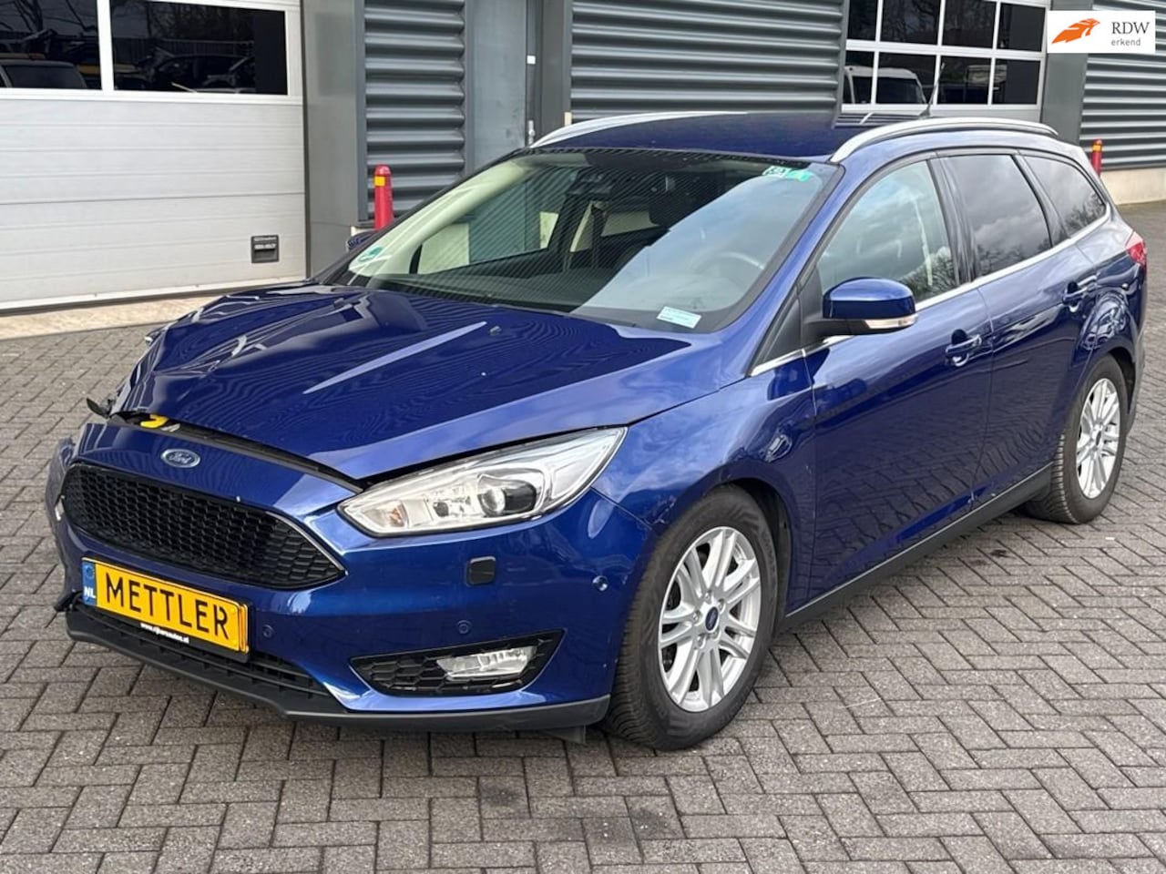 Ford Focus Wagon - 1.5 Titanium Edition 1.5 Titanium Edition, trekhaak, camera, stuurwiel verwarming, navigatie - AutoWereld.nl