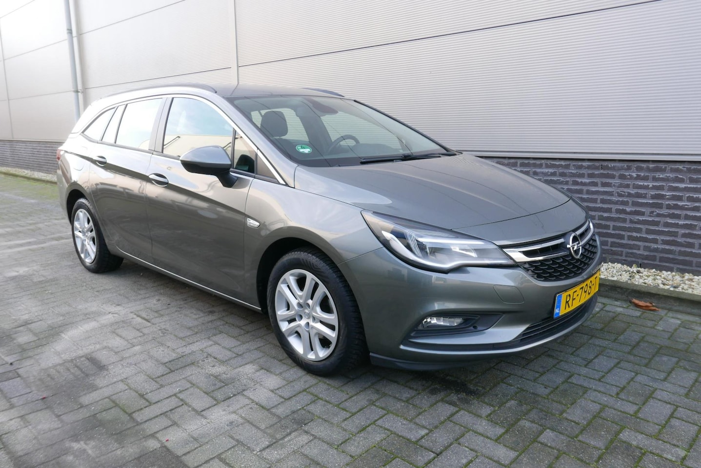 Opel Astra Sports Tourer - 1.0 Business+ NAVI,AIRCO,CRUISCONTROL,TREKHAAK. - AutoWereld.nl