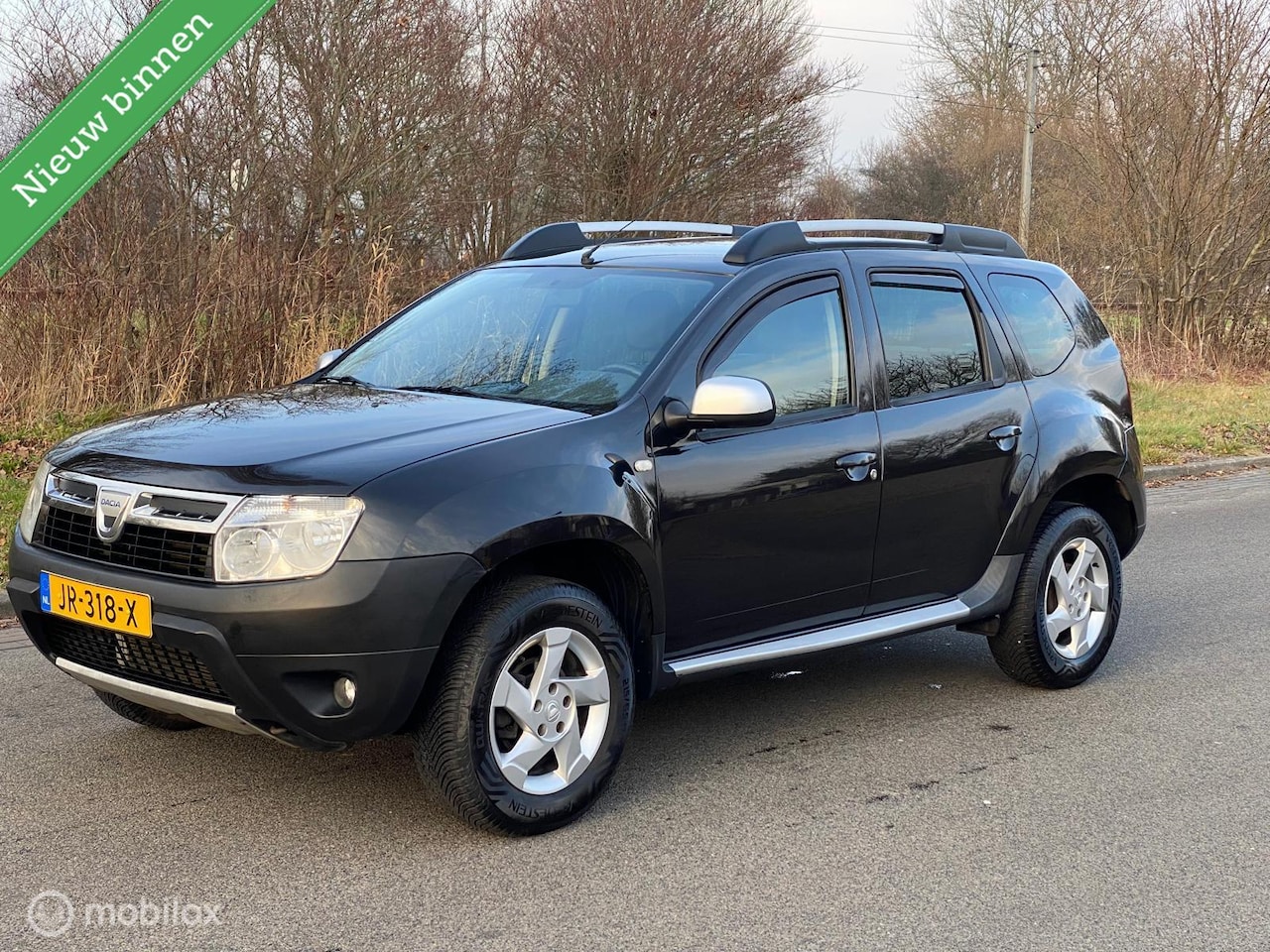 Dacia Duster - 1.6 Laureate 2wd Trekhaak Airco Leer Lmv !! - AutoWereld.nl