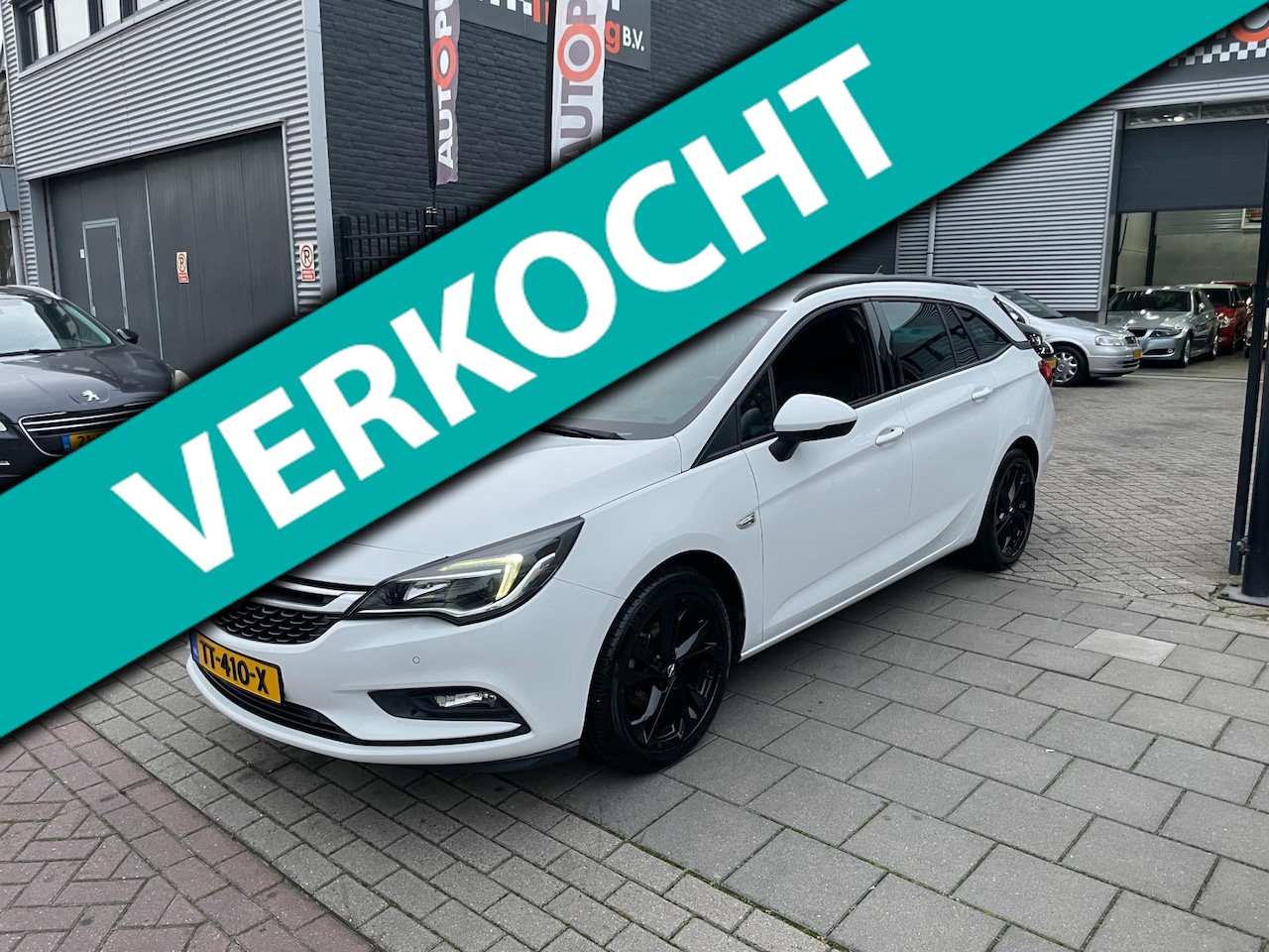 Opel Astra Sports Tourer - 1.0 Turbo Business Executive Trekhaak Airco NAP APK - AutoWereld.nl