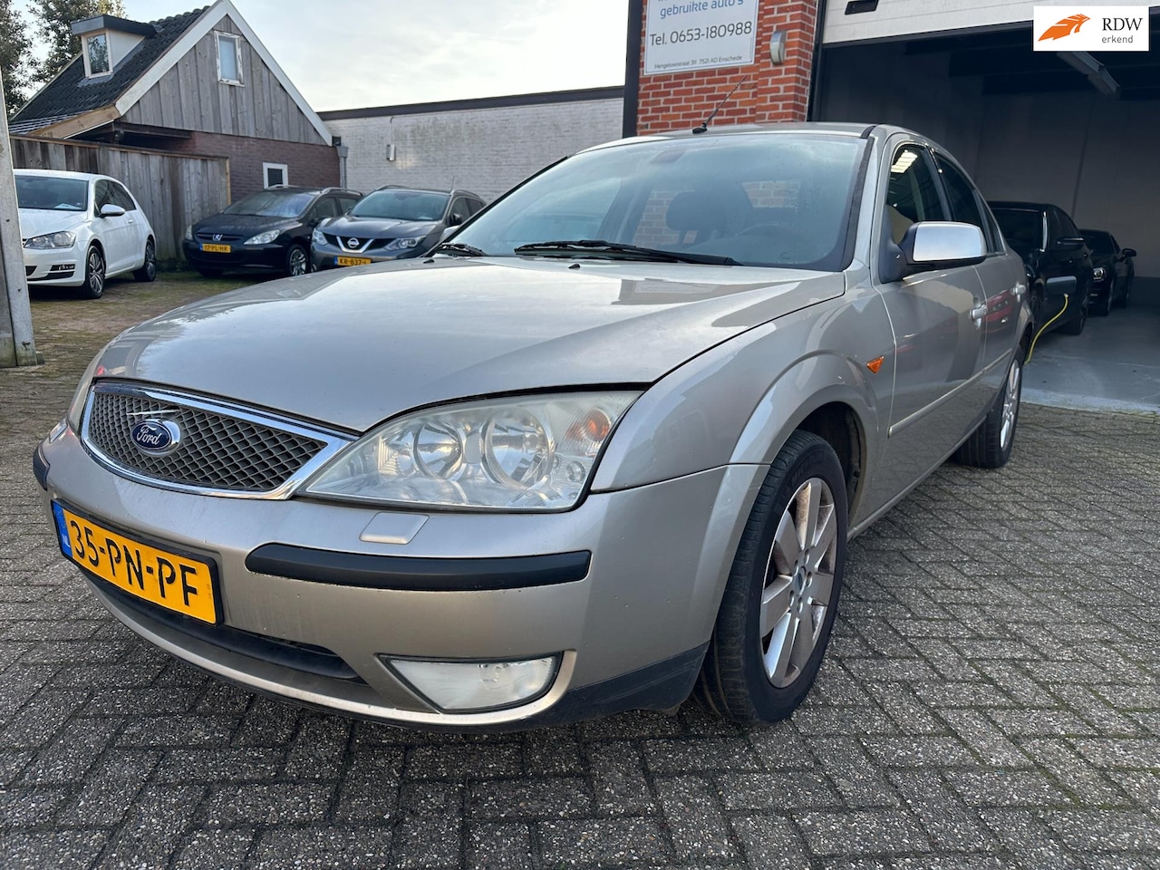 Ford Mondeo - 1.8-16V Futura CLIMA-CRUISE-PDC - AutoWereld.nl