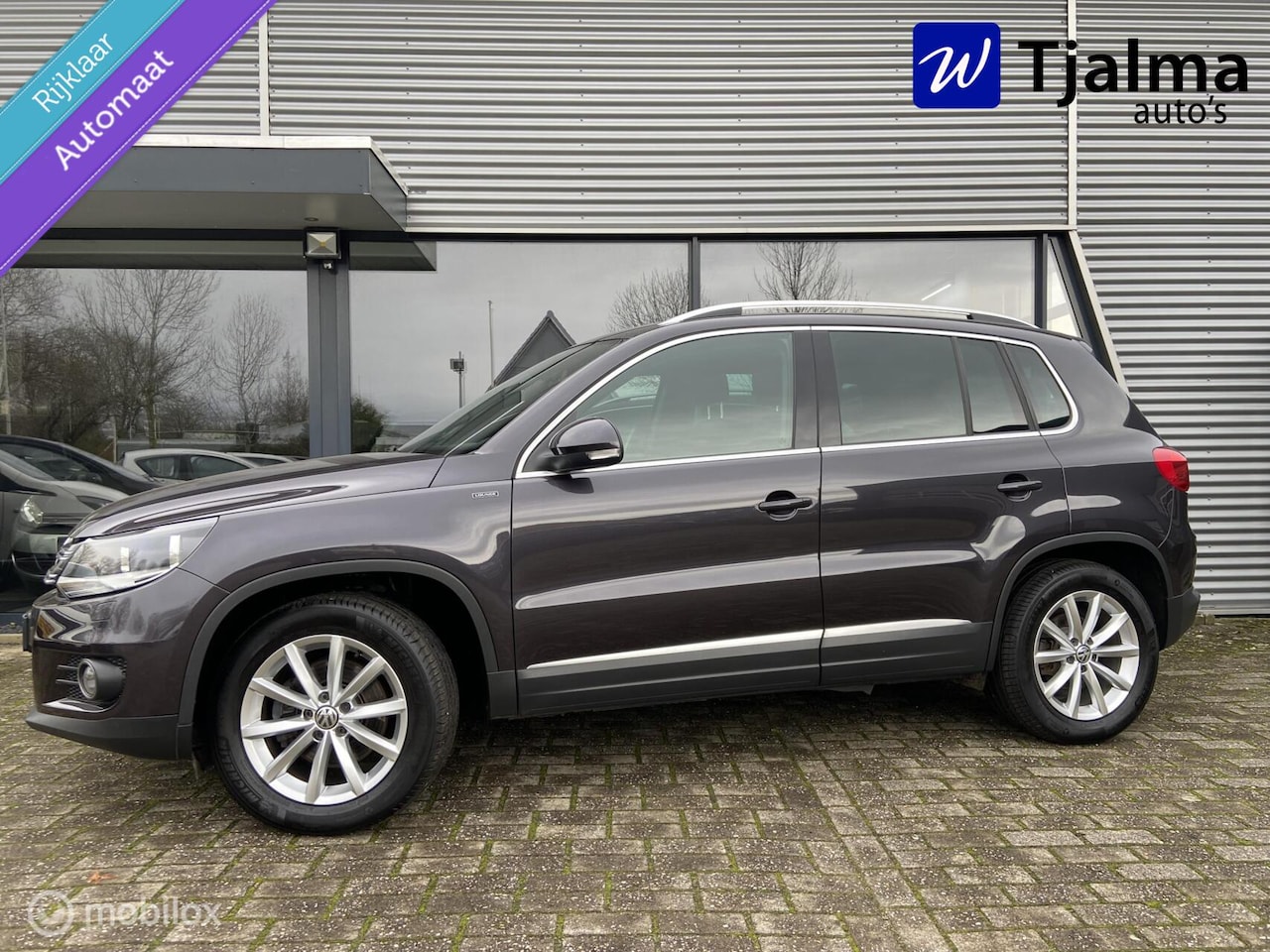 Volkswagen Tiguan - 1.4 TSI Sport&Style dsg trekh navi 1800 kg - AutoWereld.nl