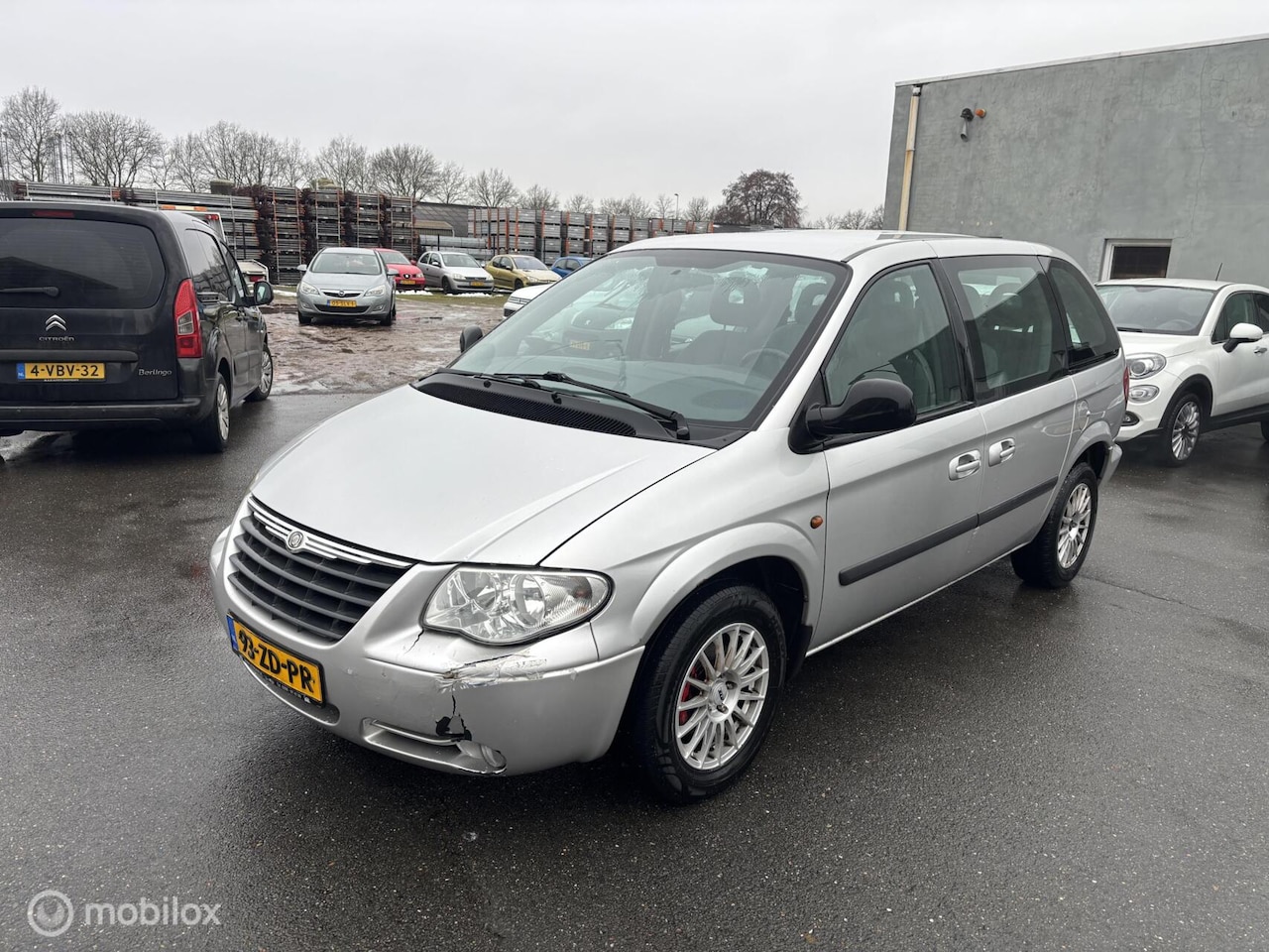 Chrysler Voyager - 2.4i SE Luxe 7 persoons - AutoWereld.nl