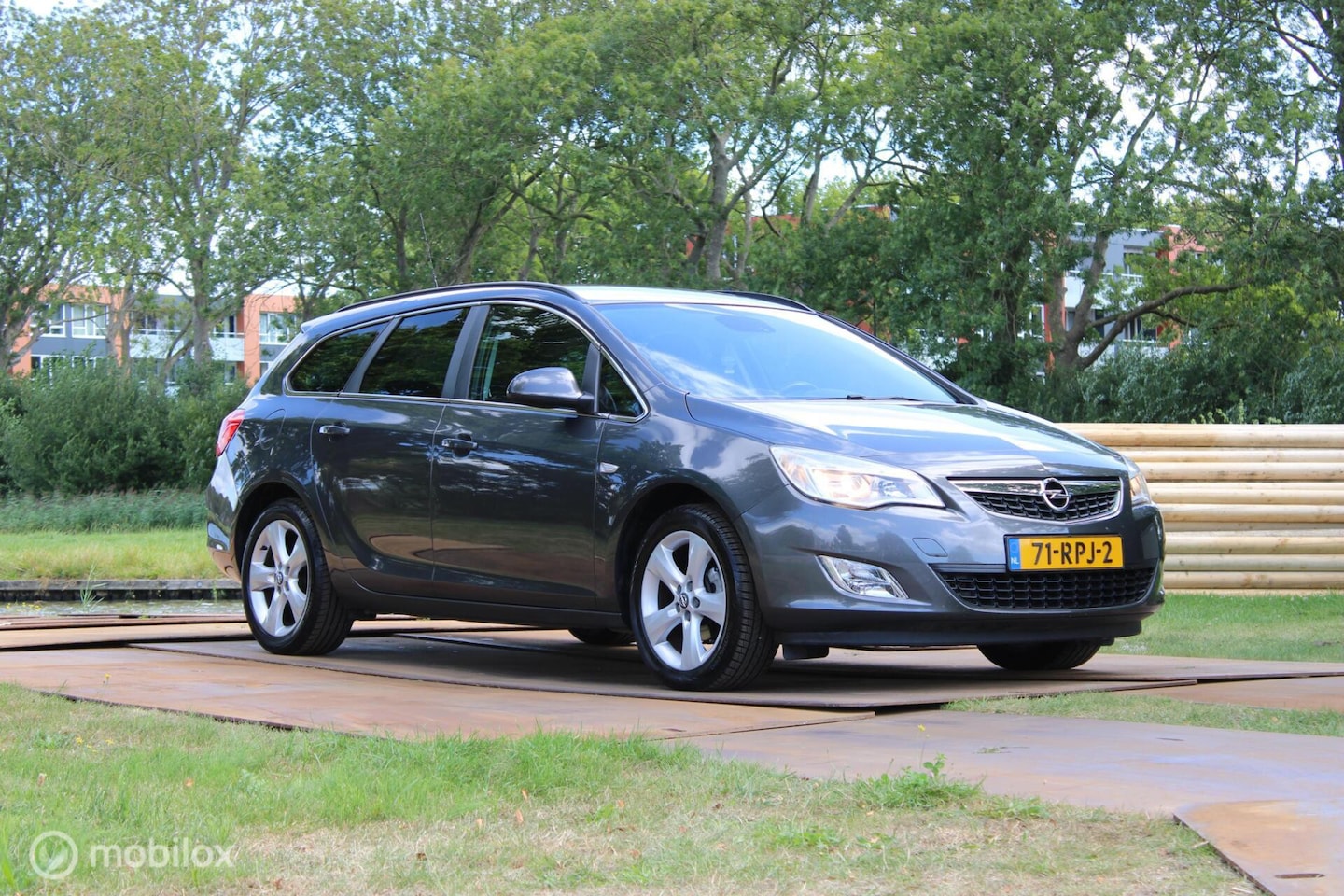 Opel Astra Sports Tourer - 1.4 Turbo Edition LEKT OLIE - AutoWereld.nl