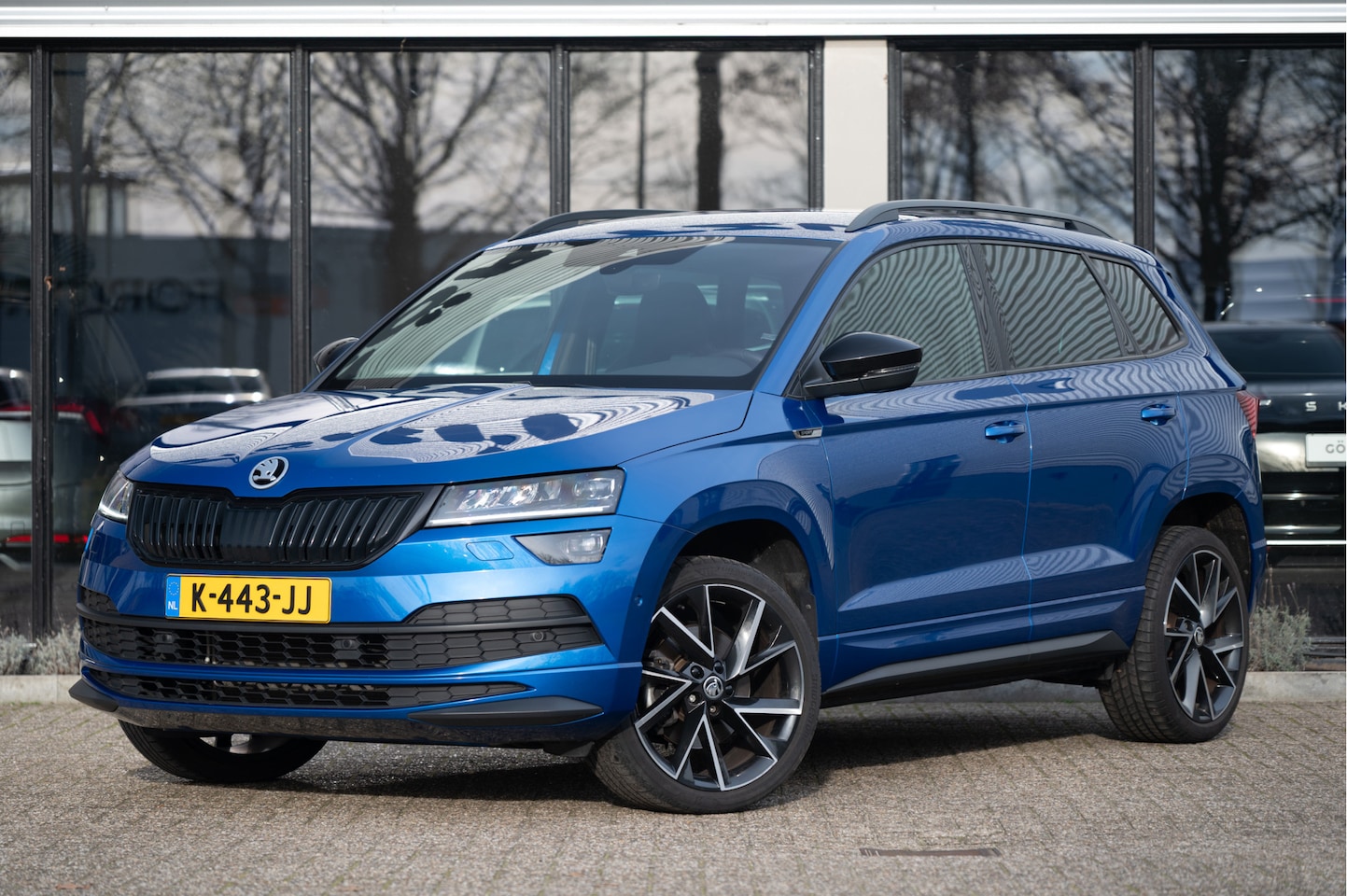 Skoda Karoq - 1.5 TSI ACT Sportline Business | Trekhaak | Adapt. Cruise | CANTON | Camera | 19" | Winter - AutoWereld.nl