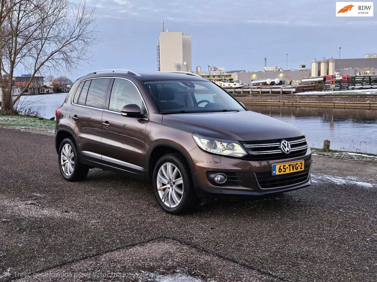 Volkswagen Tiguan - 1.4 TSI Sport&Style Luxe uitvoering | Panorama dak | Cruise | Navi - AutoWereld.nl
