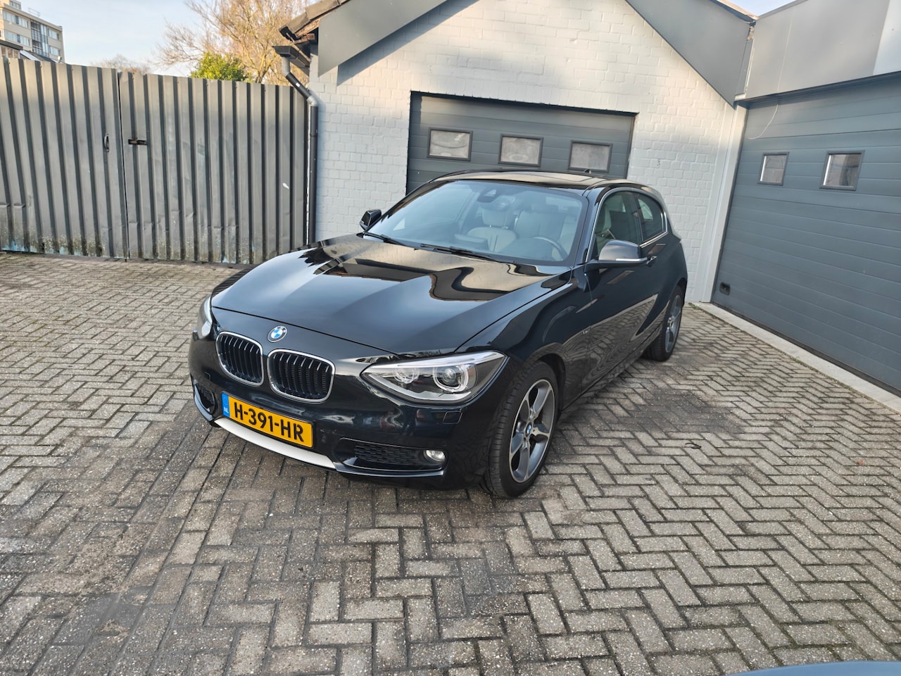 BMW 1-serie - 118i Executive 118i Executive,Parking system,Cruise control,Navi,Climate control,Schuifkantel dak - AutoWereld.nl