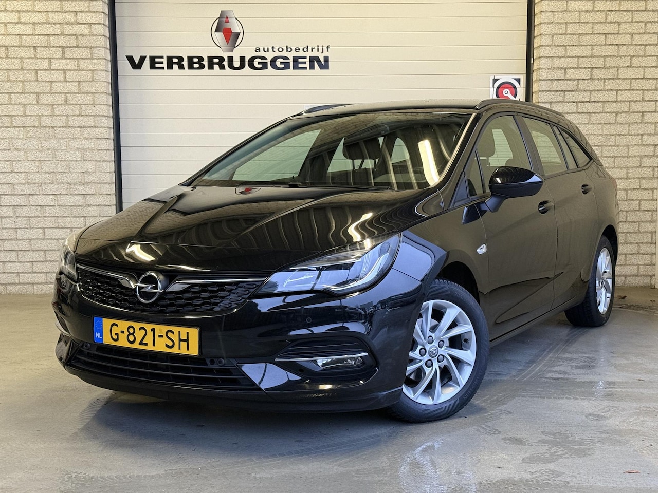 Opel Astra Sports Tourer - 1.2 Business Edition | Trekhaak | ALL-Season | Navi | PDC V+A | Cruise | All-in rijklaarpr - AutoWereld.nl