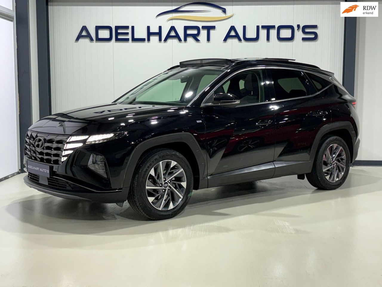 Hyundai Tucson - 1.6 T-GDI MHEV Comfort / Panorama dak / Navigatie full map / Camera / Cruise control / Key - AutoWereld.nl