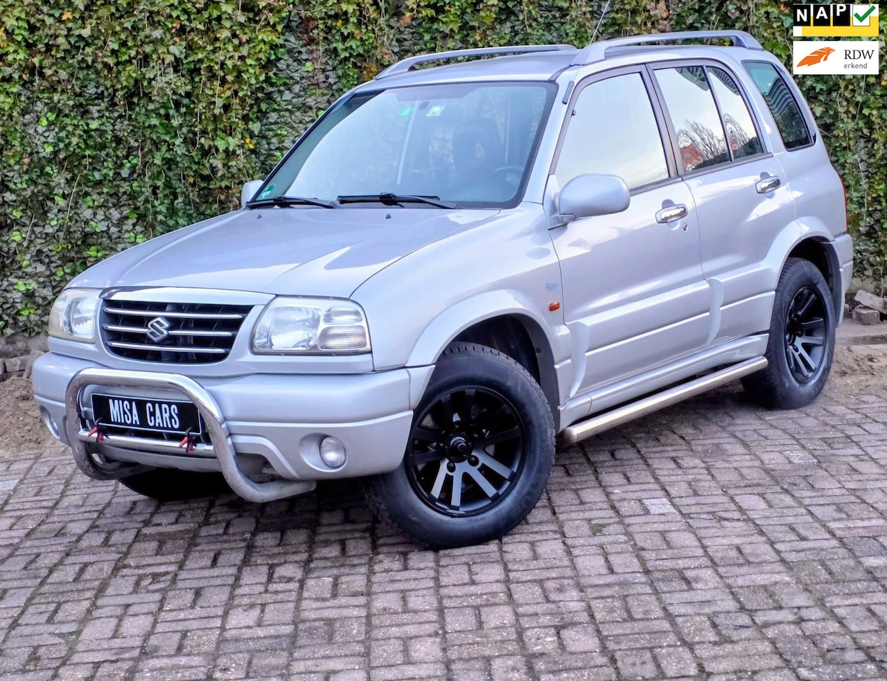 Suzuki Grand Vitara - 2.0 FreeStyle-3 Airco 4x4 Cruise Controle Trek Haak Leder - AutoWereld.nl