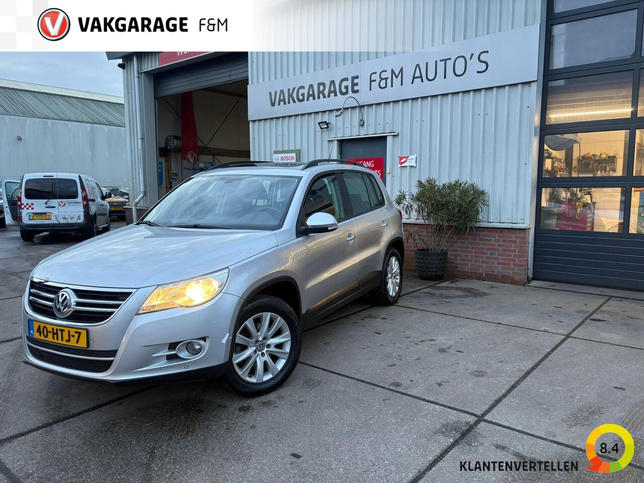 Volkswagen Tiguan - 1.4 TSI Comfort&Design Airco, trekhaak, pano, navi - AutoWereld.nl